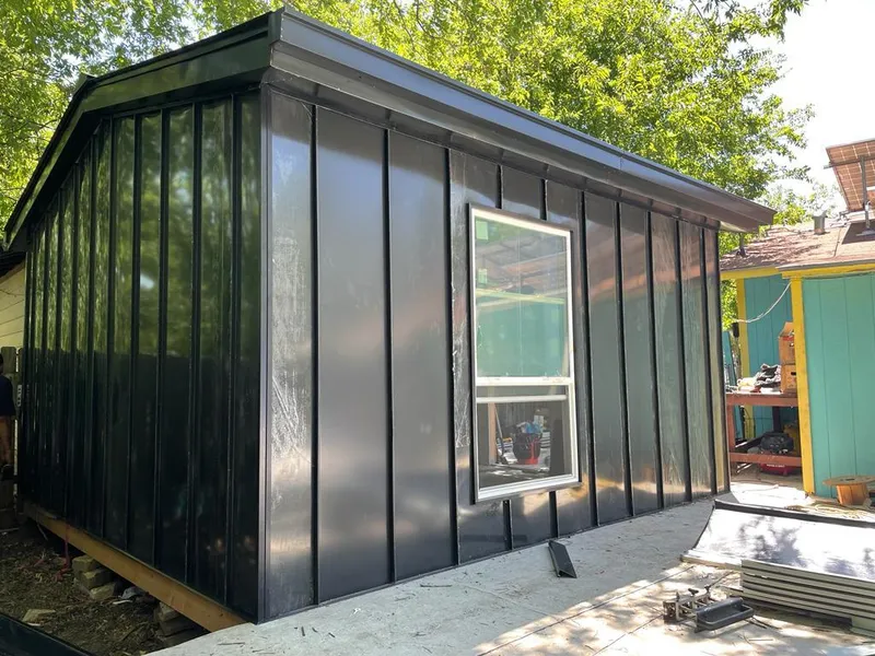 Black standing seam metal wall panels for Roof Inspection in Short Pump